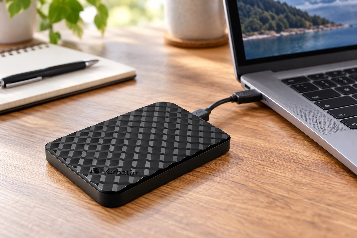Styled scene of Verbatim Store 'n' Go portable hard drive, model 53195