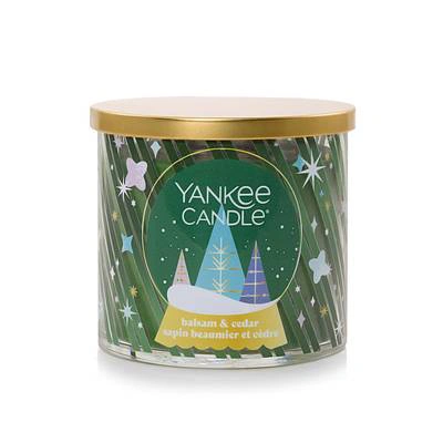 Yankee Candle 3-Wick candle with a gold lid and seasonal tree artwork, from the approved PDF