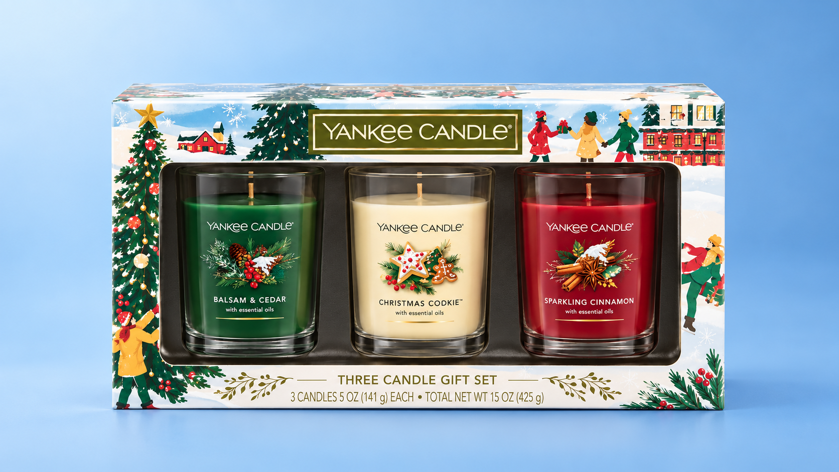 Illustration of a Yankee Candle three-candle holiday gift set against a blue background