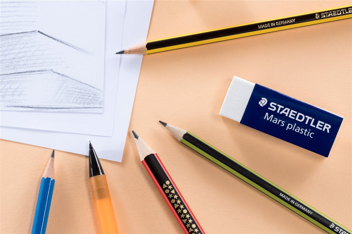 STAEDTLER pencils and eraser arranged on a drawing surface
