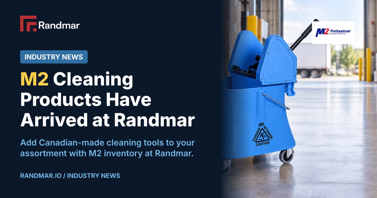 Industry News: M2 Cleaning Products Have Arrived at Randmar; Official M2 blue bucket and wringer pictured in an illustrative commercial receiving area; editorial image generated from the official product reference.